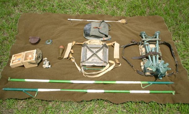 60mm M57 Bipod Pack, Spade Pack, NSB-3 Sight, Quadrant, Aiming Stakes, Cleaning Kit and HE Round 